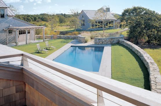 A fieldstone wall lined with sea grasses—one of the only ornamental plantings used on the site—encircles the spa for privacy and to buffer the wind.