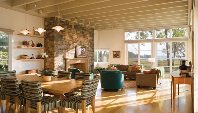 Inside the house, the same material reappears as cladding for the oversized chimney.