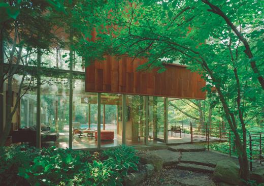 Thanks to sturdy glass walls, the great room barely seems to touch the ground.