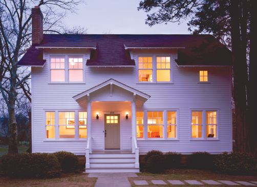 The lowered eaveline lightens the squarish facade, making the house look wider than it is tall.