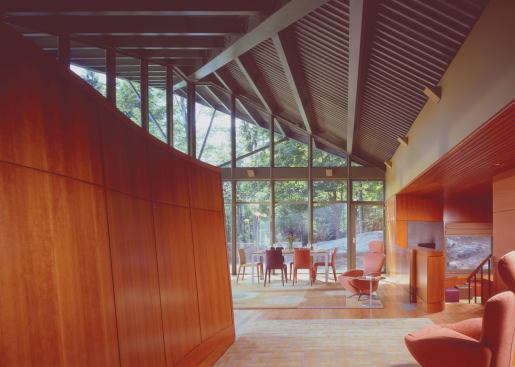 Glazed walls give the owners expansive views of their pastoral property.