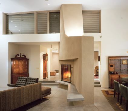 Dug into a north-facing slope, this house copes with the Napa Valley's often overpowering sunlight with louvered clerestory windows that wash south light across arched ceilings.