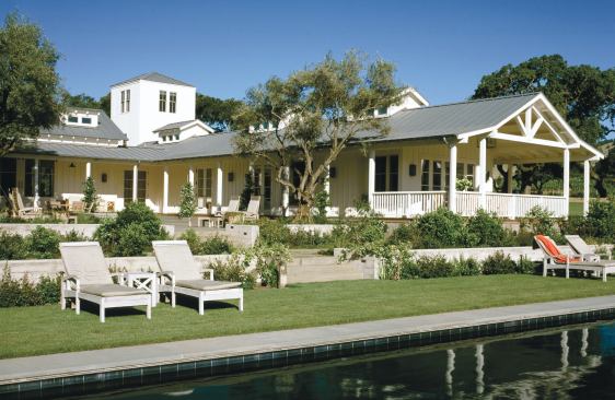 This house, on a dairy farm-turned-vineyard, takes its lead from the agricultural buildings that remain on the property. Steel roofs top low, clustered building forms clad in board-and-batten siding.