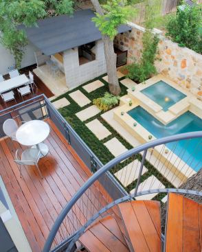 The horizontal and vertical outdoor spaces in this Austin home fit together like a 3-D puzzle. The rooftop deck and living room deck augment the compact but multipurpose backyard.