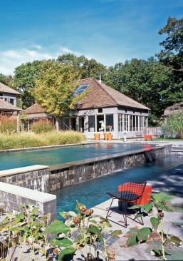 The negative-edge detail on the swimming pool adds the sound of falling water to surrounding outdoor spaces. The lower-level plunge pool is a gathering spot for cooling off.