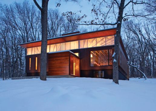 A cubelike mid-level entry makes a virtue of the feature that once distinguished this house as a "raised ranch".