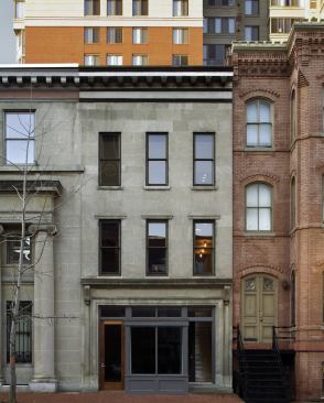 The restored historic façade of this downtown row house hides an interior that has fully joined the 21st century.