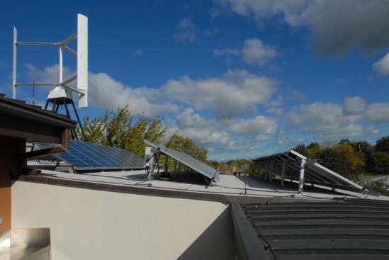 The PV system generates about 1,100 kWh a month in summer and less than 400 kWh a month in winter. The Windterra vertical-axis wind turbine generates about 240 kWh a month.