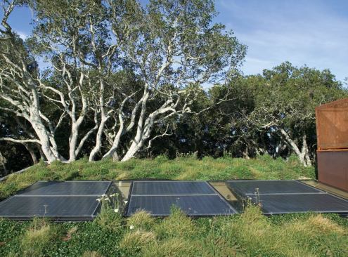 A skylight with integrated photovoltaics lets extra light into the home's central living space.