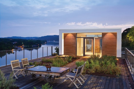 The Cliff House by Specht Architects sits on a narrow limestone ridge overlooking Lake Austin, halfway down a cliff.