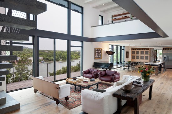 The Cliff House by Specht Architects sits on a narrow limestone ridge overlooking Lake Austin, halfway down a cliff.