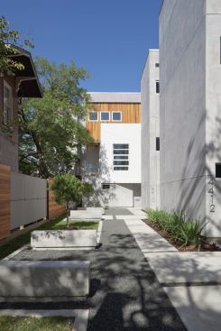 A courtyard on the front side of the building creates a buffer for neighbors.