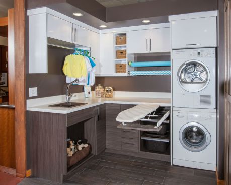 The showroom of Minneapolis-based Crystal Kitchen + Bath includes a laundry room display that features just about every must-have item on the list, including shelving, storage, a fold-out ironing board, a spot for a dog bed, hanging rod and even a station for wrapping gifts. 