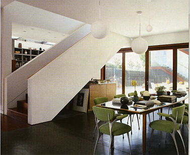 The dining room and kitchen overlook the courtyard. Folding ipe doors bring in lots of light.Undine Prohl