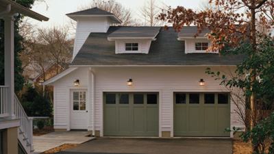 Who says a garage can't be both practical and gorgeous? That's certainly the case with this two-story, 1,152-square-foot, two-car garage that repeats many of the details of the main house.