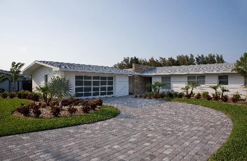 This mid-century ranch on the Banana River, part of the Intracoastal Waterway, was remodeled for a client who wanted to maximize the river view and incorporate a Miami-style resort feel without compromising the structure's compatibility with the neighborhood.