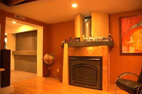 The fireplace has a copper laminate over medium-density fiberboard. Bending MDF tops the mantel.