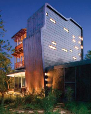 The copper-sheathed service structure takes its unusual shape from the functions it contains-stairs, baths, and closets. These minor spaces receive daylight through small windows that punctuate horizontal bands of copper that run across the west face. 'That solid mass allows the transparent one to exist,' observed one judge.