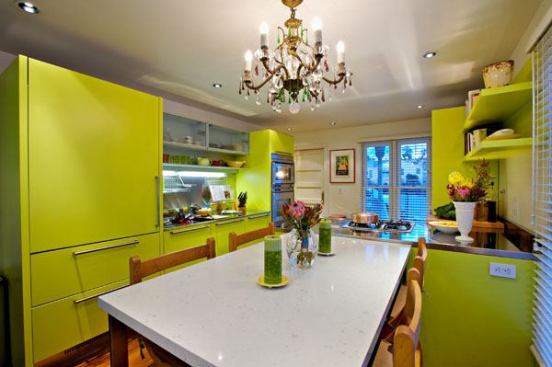 Custom, integrated dining table has stainless steel legs and a CaesarStone top.