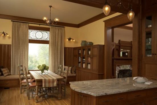Rooms are compartmentalized, as dictated by tradition, but openings were carefully arranged to create a sense of openness throughout. Wainscoting and various materials and casework echo details from the original house. The breakfast room's art glass window was relocated from elsewhere in the orignal house.