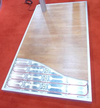 Danfoss. Reflect electric floor heating installs under laminate and engineered wood without the need for grout or another substrate during installation. A Styrofoam backing gives the product an additional R-value. 
www.danfoss.com. 
–V.M.