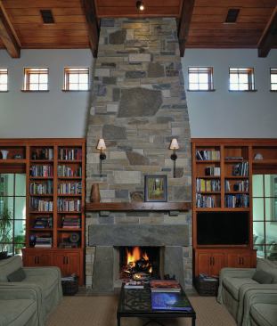 There's a 3-inch reveal between the bookcases and the stone fireplace, with the molding scribed around the stone."It's the prettiest stonework in the state of Texas," says builder Steve Friedman of Pyramid Constructors.