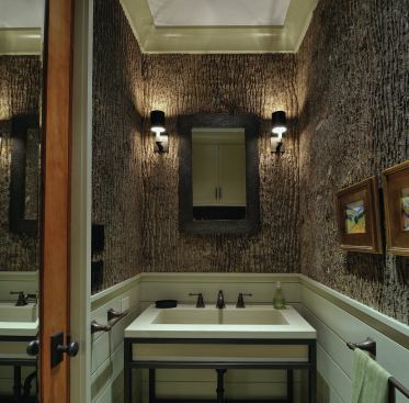 Like much of the house, the powder room gets inspiration from the great lodges in America's National Parks, which the homeowners love to visit. The bark was hot-glued to a piece of pllywood to provide a smooth panel underneath.
