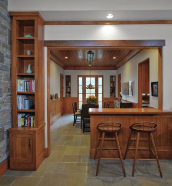 From the garage, the back entrane to the house leads into the breakfast room, which opens to the family room and the kitchen. 