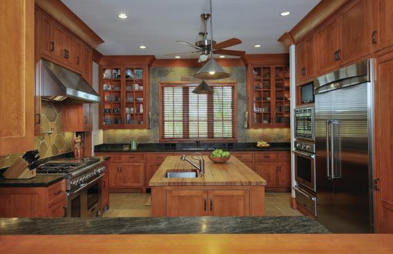 In the spacious, cook's kitchen is a mix of materials: granite countertops, Douglas Fir cabinetry, and white oak and slate floors.The island is big enough for two to cook dinner together, and it's great for baking.