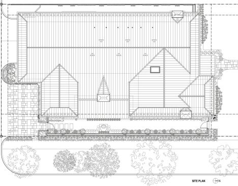 The house is close to the street and sidewalk, in keeping with other homes in this old established neighborhood in Houston, near Rice University.The home is 4950 square feet, and the corner lot measures 60 by 120  feet.Mature  live oaks sit on both street-facing sides of the house.