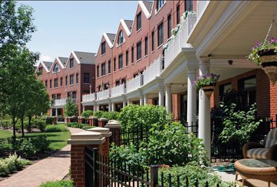 The new residents—young professionals and empty-nesters—are indispensable to the project's success, so the architects didn't stint on their homes' architectural details. Landscaped entry courtyards, bays, and canopies add rhythm to the long red-brick façades of the 154 townhouses.