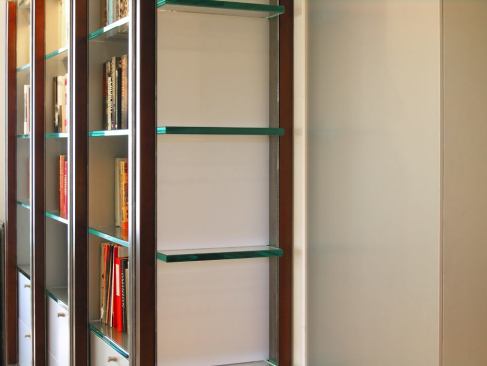 Aluminum drawers sit under the glass shelves and within steel supports.