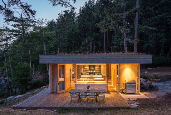 When opened, the carved wooden screens on Lone Madrone look like nothing more than inventive detailing, but when closed, they keep the house safe from damage from driving winds and rain.