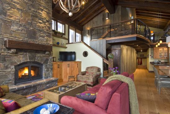 In the core of the home, the open great room allows for easy interactions between the kitchen, dining area, and living room.