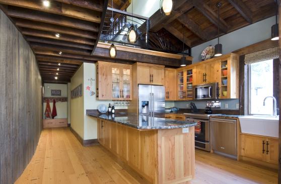 The kitchen features a salvaged sink and cabinets made of reclaimed Douglas fir with repurposed hardware.