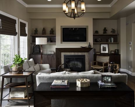The custom fireplace mantel is made from reclaimed locally harvested black walnut with FSC-certified core material and a natural lacquer finish derived from tree sap.