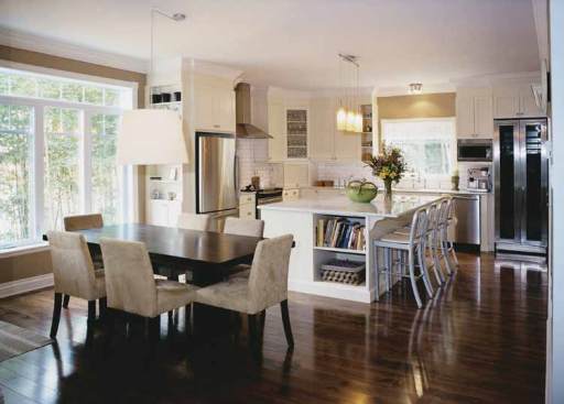 
  Instead of a formal dining room and separate breakfast
nook, this layout merges the two into an open eating area that sits between the
great room and the island kitchen.
