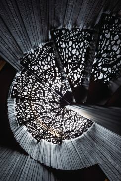 Almost every inch of the house is custom-detailed. The burnt-cedar-lined stairwell features light-filtering stair treads inspired by prickly pear skeletons, cicada wings, and the shade of a mesquite tree. 