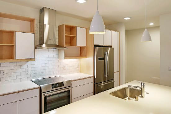 Two new high-performance homes in Seattle blend in with their industrial neighborhood while maintaining the highest levels of sustainability.