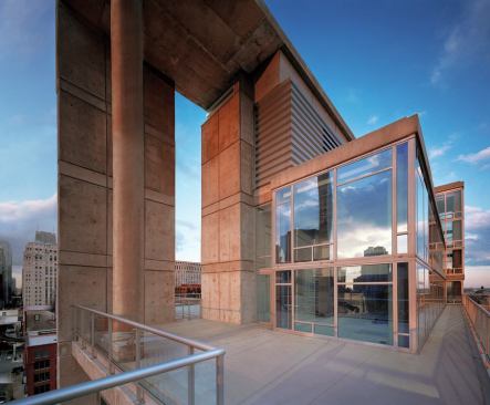 Contemporaine's strong roofline, defined by a concrete canopy and projecting penthouse unit, establishes the building as a piece of skyline sculpture.
