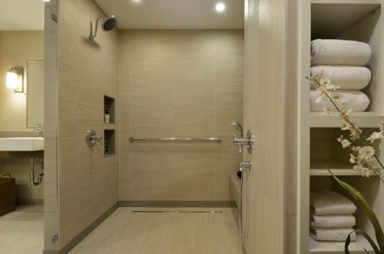 The shower has two heads; one for sit-down and one for wheelchair access. 