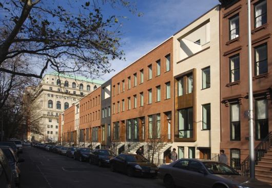 The 14 Townhouses development by Rogers Marvel Architects is situated on a lot that sat vacant for 60 years. A modern interpretation of the classic townhouse typology, the project creates a unified streetfront while maintaining a sense of individuality for each house through subtle variations in facade planes and finishes.