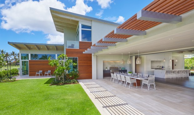 The house opens in dramatic fashion to the golf course view. The Ipe rain-screens and trellis will weather naturally and over time will gracefully blend into the soft monochromatic color palette.