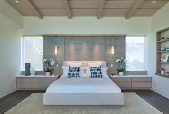 The Master bedroom provides a serene oasis and a view of the golf course from corner glass windows. Pocketing glass doors (in foreground) lead to a private lanai.