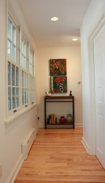 This farmhouse had received several updates and renova-
tions over the years. However, the floor plan was conflict-
ing amongst the kitchen, laundry, mudroom, and powder 
room. A complete reorganization of the first floor was 
achieved through multiple structural changes that al-
lowed for a larger kitchen and created better flow be-
tween adjacent rooms. The kitchen includes custom 
painted cabinetry, a farmhouse style sink, and soapstone 
countertops. A commercial size Viking range, hood, and 
Sub Zero refrigerator bring a theme of stainless steel to 
the kitchen which is accentuated by brushed nickel hard-
ware and island faucet. Specialty lighting, glass door 
cabinets, and a grand, eight foot island are just a few of 
the features that make this kitchen stunning.