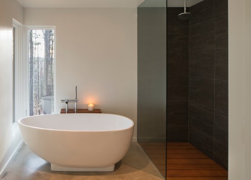 Views are curated in even the most intimate of spaces—and the shower floor in the master bath brings the outdoors in. 