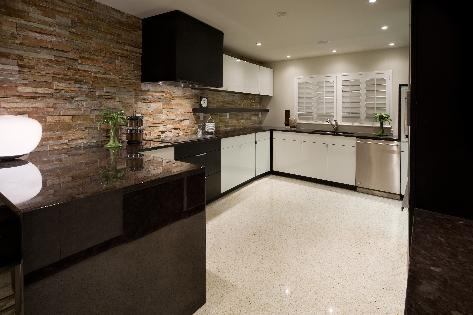 The kitchen features custom cabinets, granite countertops and GE Monogram appliances.