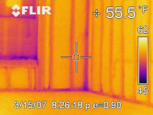 This infrared image shows the cold studs in a heated house on a winter day. Exterior foam insulation could prevent this source of heat loss.