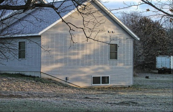 Melted lines on a frosty wall show the heat passing through the wall at stud locations. Exterior foam insulation would make a difference.