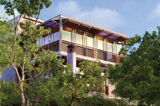 A system of aluminum shutters can be manually opened and closed in multiple combinations, and folded up to form an overhang for the glass structure. The system, imported from Spain, provides sun, wind, and vandal protection for the guesthouse.